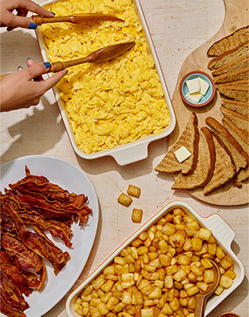 breakfast-catering-scrambled-eggs-bacon-potatoes Breakfast catering with scrambled eggs, bacon, toast, and breakfast potatoes