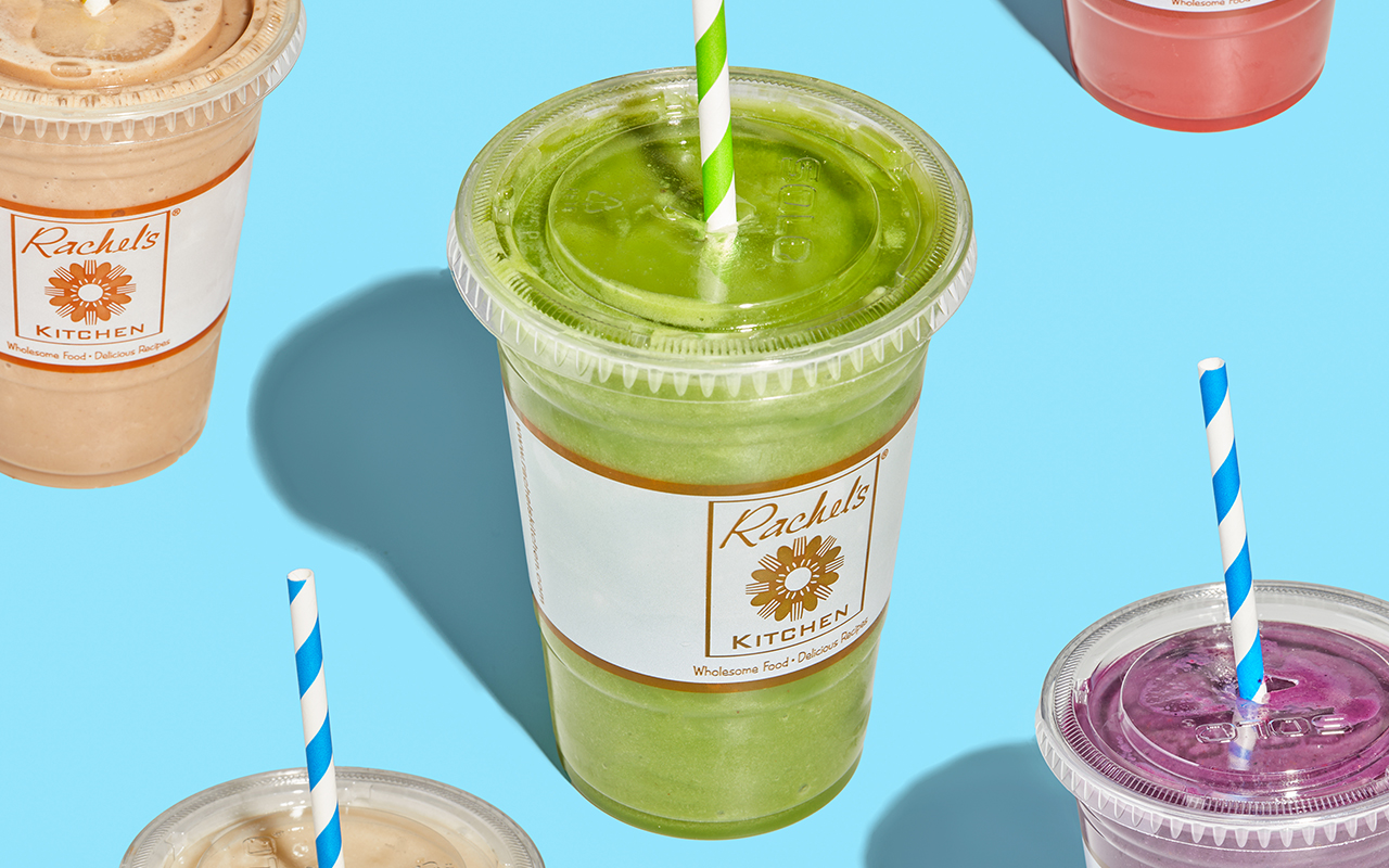 Rachel's Kitchen smoothies like Green Smoothie, Peanut Butter Blast Smoothie and Berry Mania Smoothie on a blue background